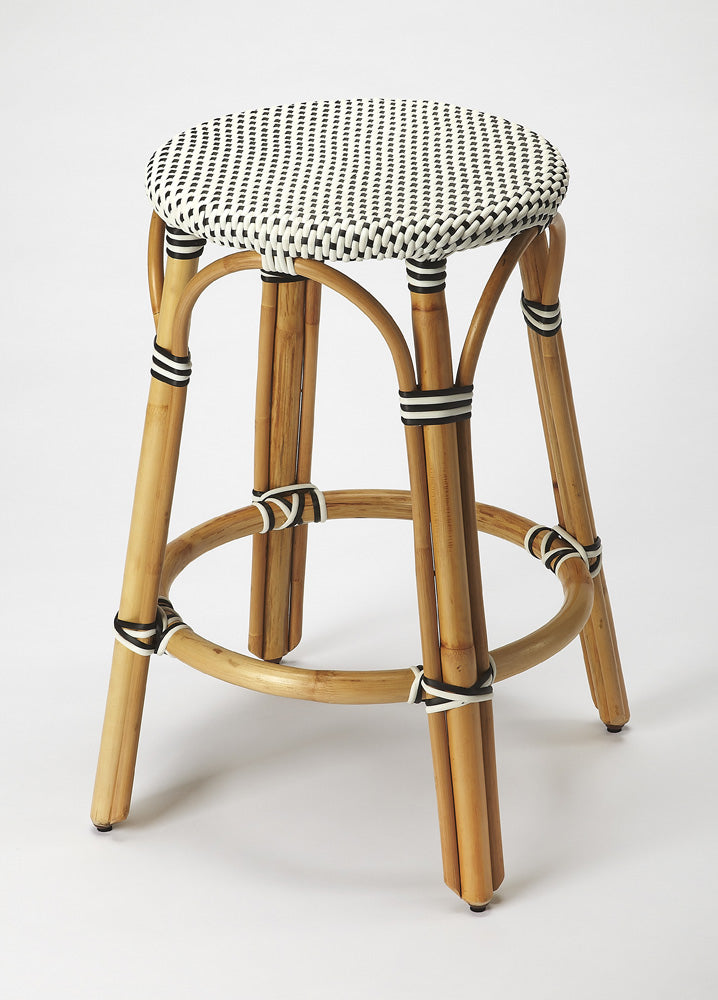 Butler Specialty Company - Tobias 24 in. Seat Height Rattan Round Backless Counter Height Stool with Footrest, Black/White Dot - 9371295