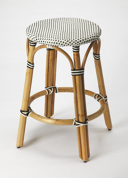Butler Specialty Company - Tobias 24 in. Seat Height Rattan Round Backless Counter Height Stool with Footrest, Black/White Dot - 9371295