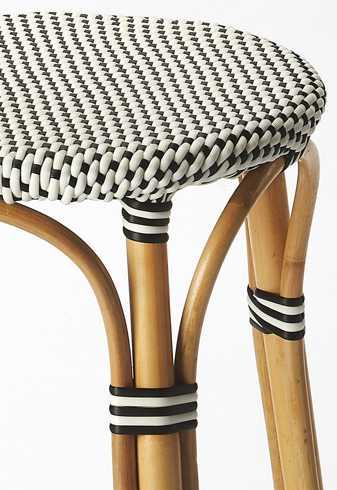 Butler Specialty Company - Tobias 24 in. Seat Height Rattan Round Backless Counter Height Stool with Footrest, Black/White Dot - 9371295