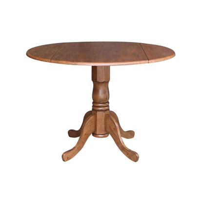 International Concepts - 42in Round Dual Drop Leaf Ped Table in Distressed Oak Finish - T42-42DP veiw 1