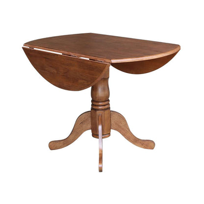 International Concepts - 42in Round Dual Drop Leaf Ped Table in Distressed Oak Finish - T42-42DP veiw 3