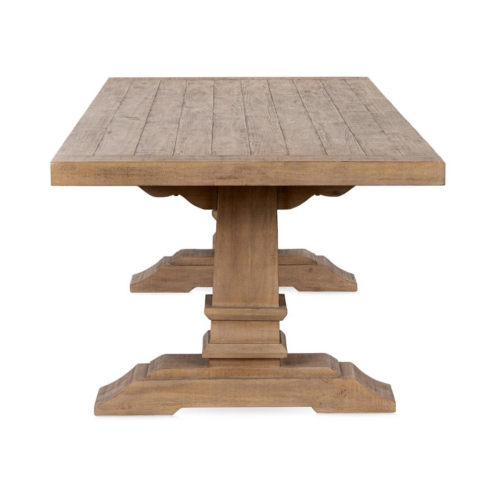 Reclaimed pine wood dining table with carved support.