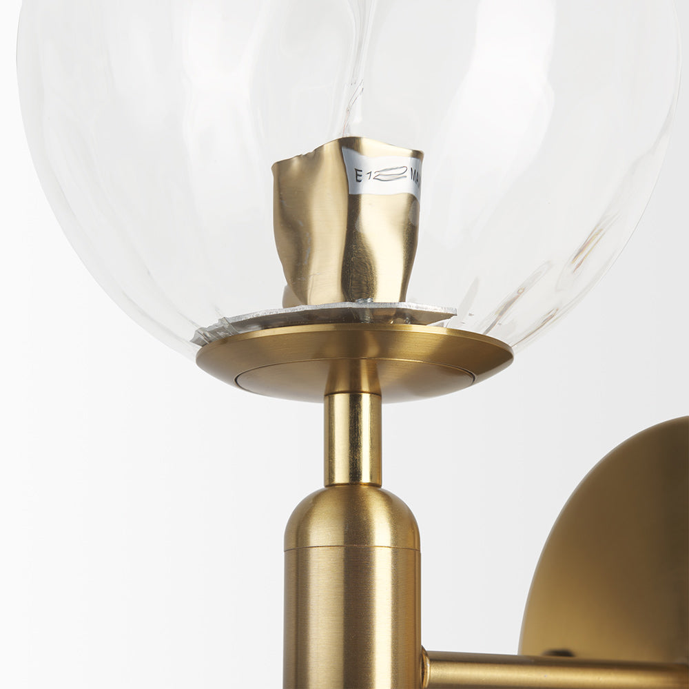 Mercana - Britton Gold Metal w/ Clear Glass Globe 1-Light Wall Sconce - 70472 view 4