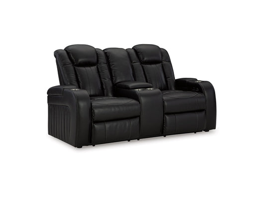Signature Design by Ashley - Caveman Den Pwr Reclining Loveseat W/Adj Headrest & Console in Midnight - 9070318 veiw 1